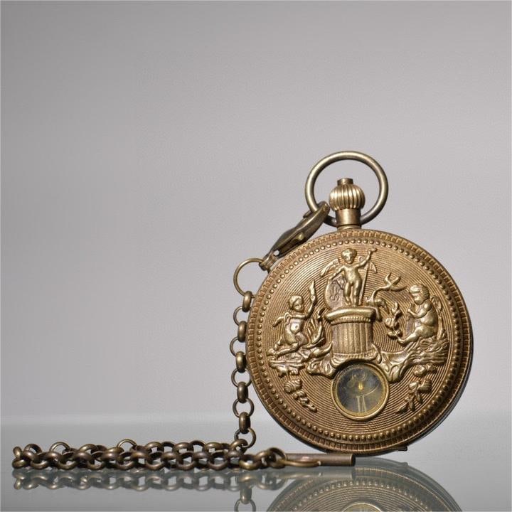 A nineteenth-century bronze angel and Holy Spirit sun, moon, and stars double-opening pocket watch (1 of 8)