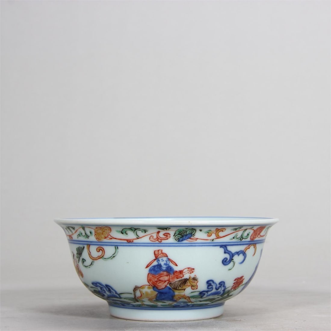 A small bowl from the Ming Dynasty with a five-colored gaoshi (scholar's design) in blue-and-white: A small bowl from the Ming Dynasty with a five-colored 'Gaoshi' motif Size:H:4.7cm D:11.3cm (The Dimensions Of All Batches Are Manually Measured.If You Need More Detailed Information, Please Contact O