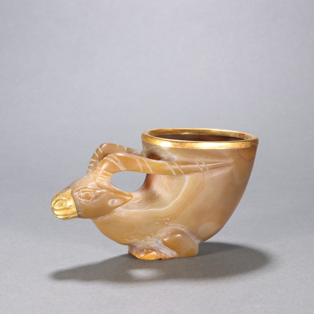 A Liao and Jin agate-wrapped lamb-head cup: Liao and Jin agate-wrapped lamb-head cups Size:H:6.7cm W:12cm W:0.2563kg (The Dimensions Of All Batches Are Manually Measured.If You Need More Detailed Information, Please Contact Our Customer Service