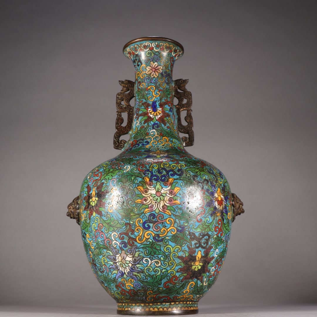 A Qing dynasty cloisonnÃ© entwined lotus pattern chi dragon ear vase: A cloisonné vase with entwined lotus patterns and dragon ears from the Qing Dynasty Size:H:29.5cm W:19.3cm W:4.3kg (The Dimensions Of All Batches Are Manually Measured.If You Need More Detailed Infor