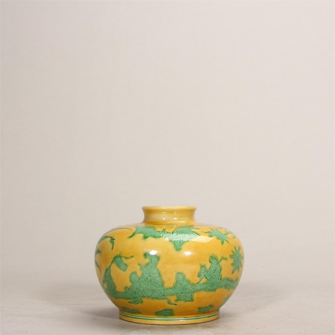 A Ming Dynasty yellow and green apple wine vessel with a picture of infants playing in play: A Ming dynasty yellow and green painted infant playing with an apple zun Size:H:7.2cm (The Dimensions Of All Batches Are Manually Measured.If You Need More Detailed Information, Please Contact Our Cus
