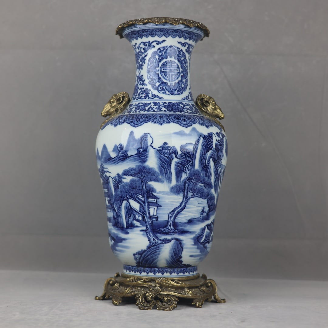 A fine blue-and-white Guanyin vase with Fushou landscape patterns inlaid with copper ram-ear Guanyin (1 of 10)