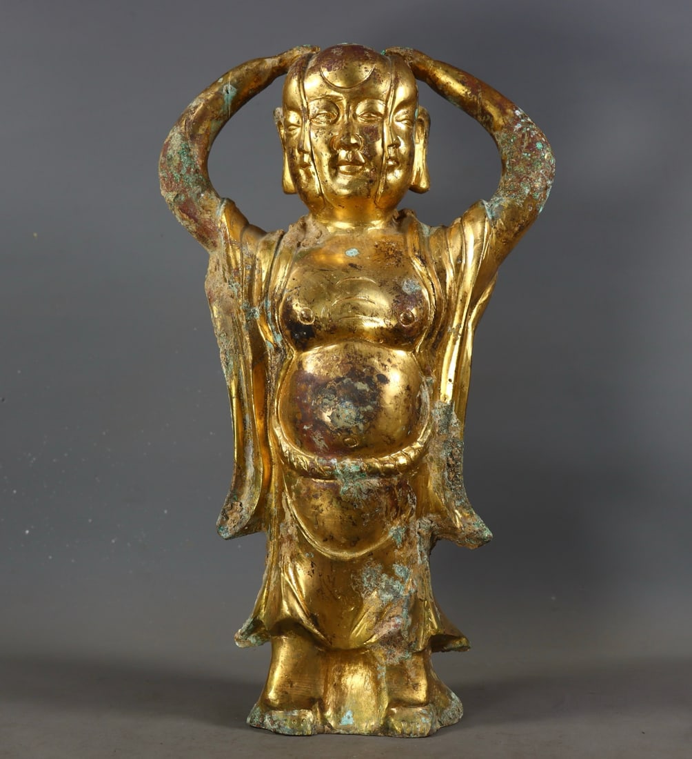 A gilded bronze Arhat from the Northern Wei period: A gilded bronze Arhat from the Northern Wei period Size:H:34cm L:19cm W:9.5cm W:3.198kg (The Dimensions Of All Batches Are Manually Measured.If You Need More Detailed Information, Please Contact Our C