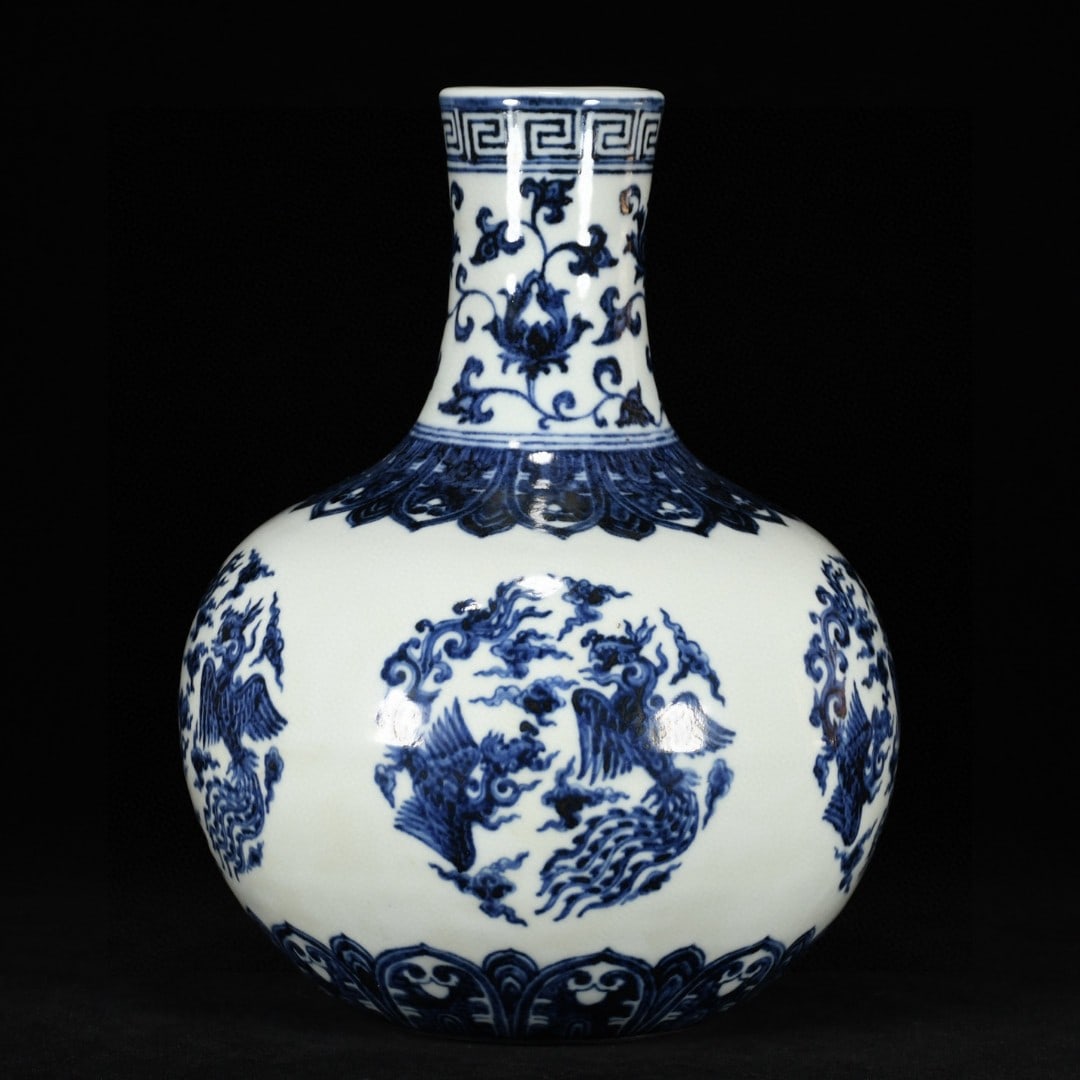 A Ming Dynasty Xuande period blue-and-white lotus with entwined branches and a multi-opening window: A blue-and-white entwined lotus with multiple window rounds and phoenix patterns, made during the Xuande period of the Ming Dynasty Size:29x22cm (The Dimensions Of All Batches Are Manually Measured.If