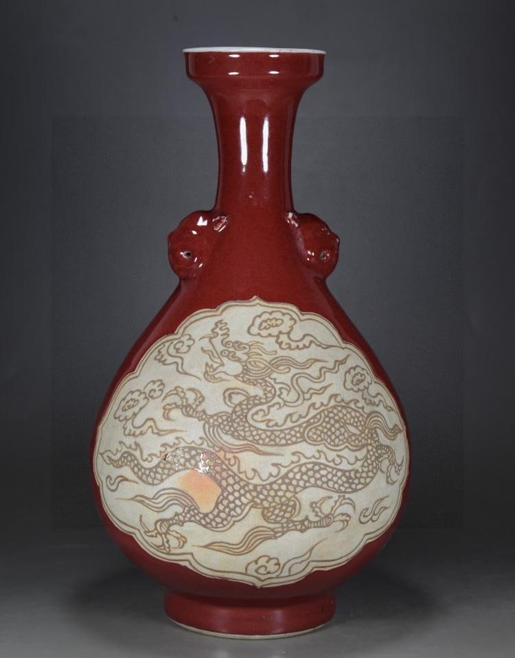 A fine Yuanji red-glazed double-window reed white carved dragon and beast-head vase (1 of 9)