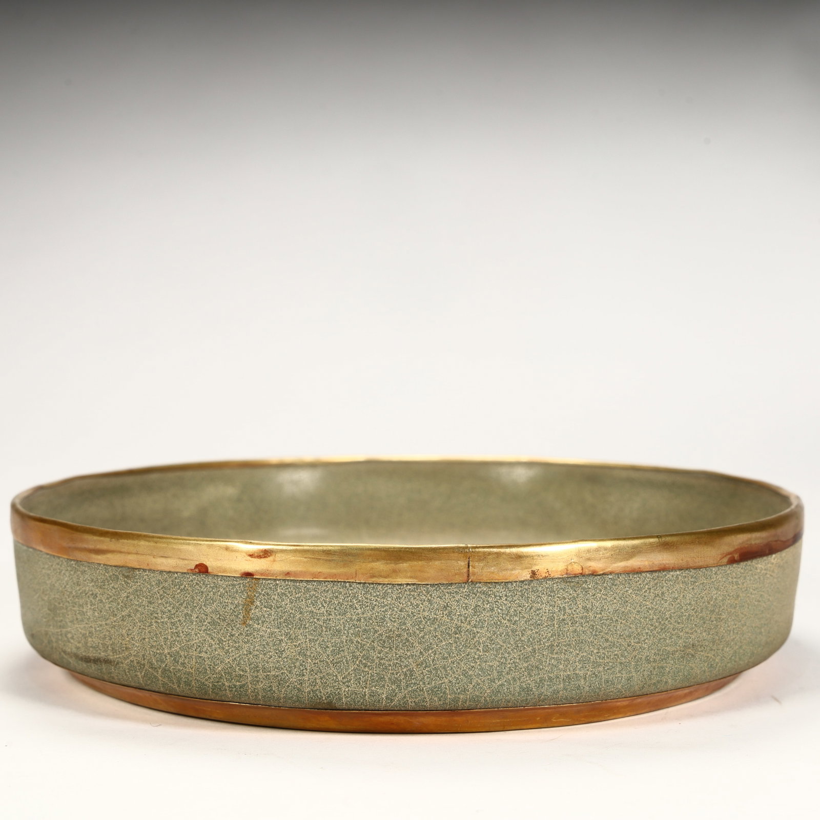 A Song Dynasty celadon crackle-gilded folded edge wash: Song Dynasty celadon crackle-gilded folded edge wash SIZE: H:4cm L: 18.5cm W:18.5cm W:657g (The Dimensions Of All Batches Are Manually Measured.If You Need More Detailed Information, Please Contact Ou