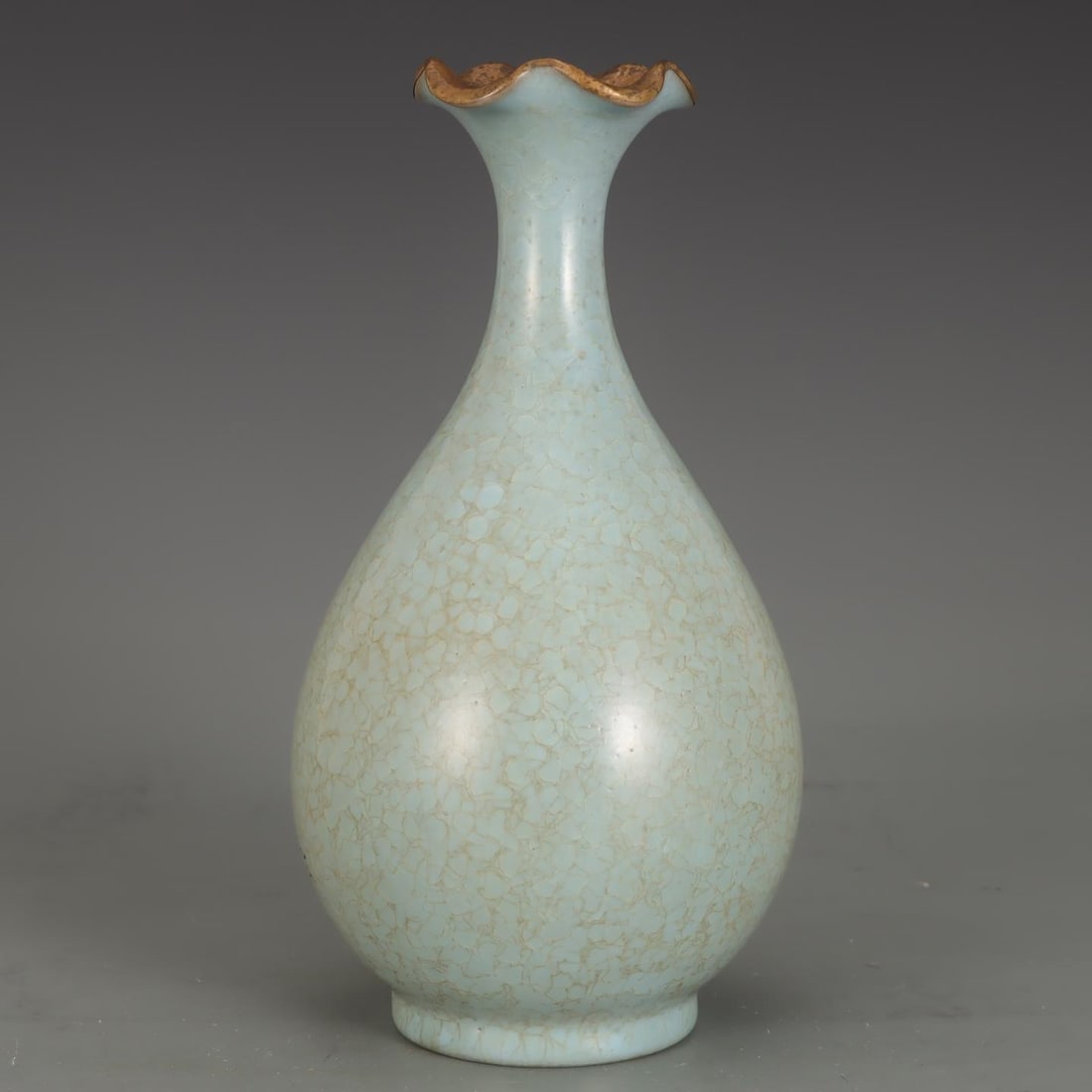 A Song Dynasty Ru kiln vase with sky-blue glaze and gold-inlaid floral rim: A sky-blue glazed and gold-inlaid floral vase from the Song Dynasty Ru kiln Size:H:23cm Belly diameter:12.6cm (The Dimensions Of All Batches Are Manually Measured.If You Need More Detailed Information