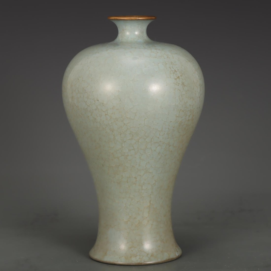 A Song Dynasty Ru kiln vase with sky-blue glaze and gilded buckle plum vase: A sky-blue glazed gold-inlaid plum vase from the Song Dynasty Ru kiln Size:H:23cm Belly diameter:13.6cm (The Dimensions Of All Batches Are Manually Measured.If You Need More Detailed Information, Plea