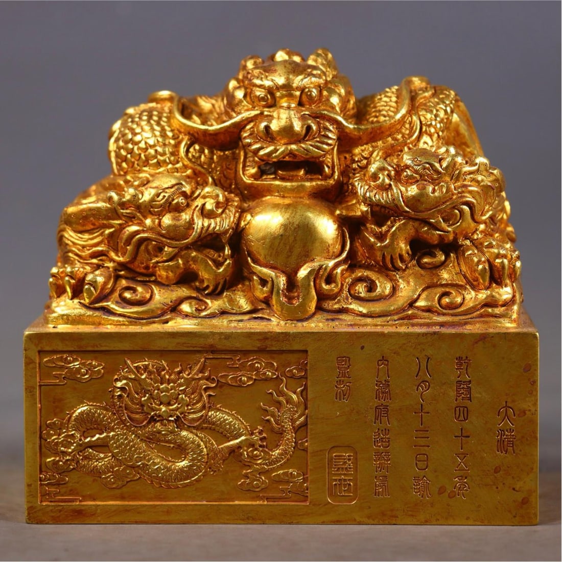 A finely crafted copper gilt coiled dragon seal (1 of 9)
