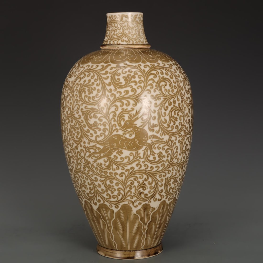 A Song Dynasty Ding ware Ding ware brown-painted carved scroll grass green-patterned plum vase: A brown-painted carved scroll grass green-patterned plum vase from the Ding kiln of the Song dynasty Size:H:39cm Belly diameter:22cm (The Dimensions Of All Batches Are Manually Measured.If You Need Mo