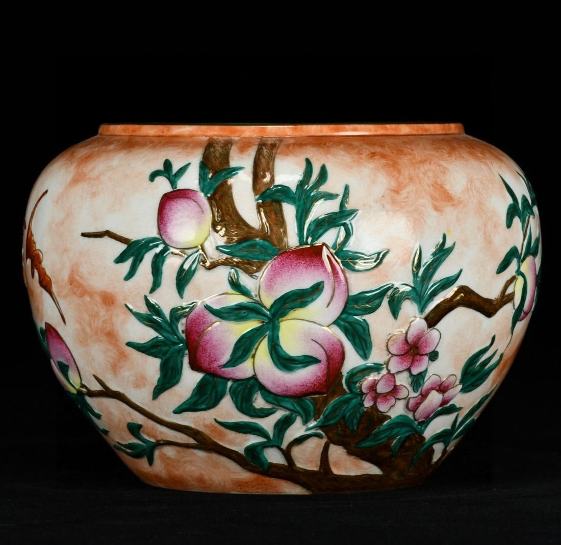 A famille rose and gilt carved brush washer with five blessings and nine peaches patterns, made: A famille rose and gilt carved brush washer with five blessings and nine peaches patterns, made during the Qianlong period of the Qing Dynasty Size:12x17cm (The Dimensions Of All Batches Are Manually 