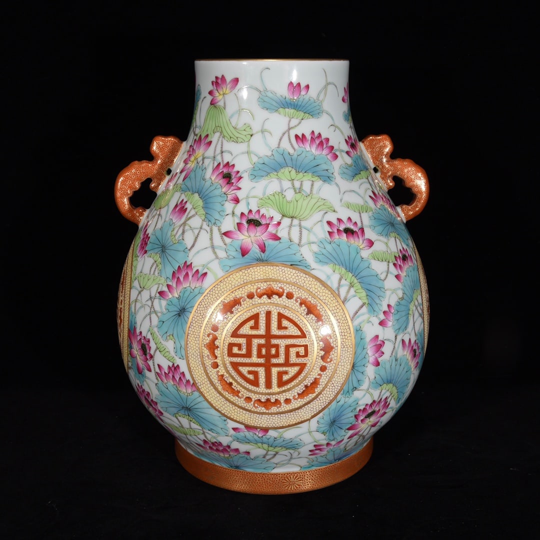 A double-handled wine vessel made during the Qianlong period of the Qing Dynasty, featuring lotus: A double-handled wine vessel with lotus leaf pattern opening windows and fortune and longevity patterns, made during the Qianlong period of the Qing Dynasty Size:34x28cm (The Dimensions Of All Batches