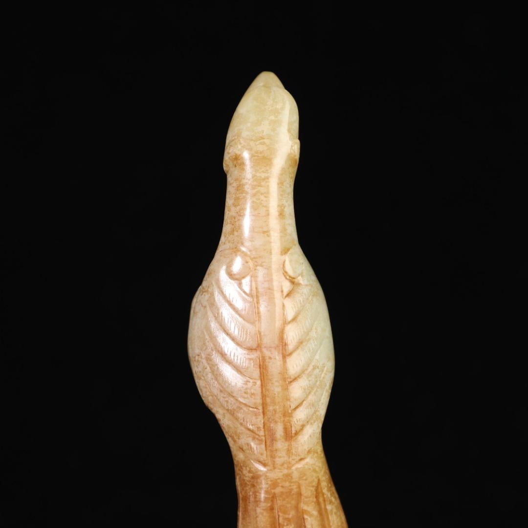 A finely crafted ancient jade bird-shaped staff head (1 of 9)