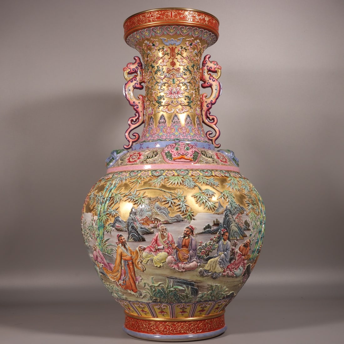 A Qing Dynasty Yongzheng period enamel carved gold ground panoramic bamboo grove with dragon ears: A dragon-eared vase with dragon ears carved in gold and a panoramic bamboo grove, featuring the Seven Sages of the Bamboo Grove, made during the Yongzheng period of the Qing Dynasty Size:H:67cm Belly 