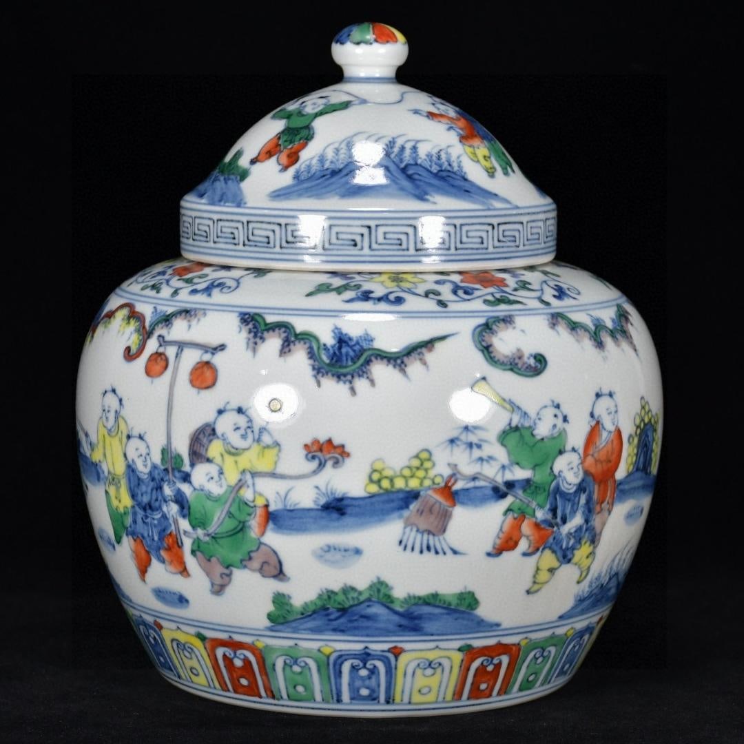 A Ming Dynasty Chenghua period official kiln jar with a 'Doucai' (Joyful Joy) lidded jar depicting (1 of 8)
