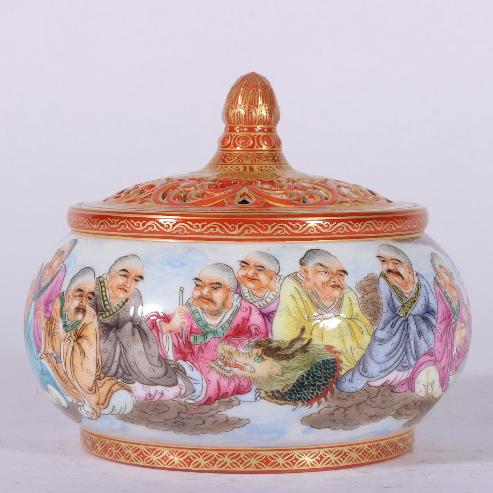 A Qing Dynasty Qianlong period enamel alum, red with gold accents, and eighteen arhat incense: The Qianlong period of the Qing Dynasty enamel alum, red with gold accents, and a panoramic Eighteen Arhats incense burner Size:H:10cm Belly diameter:11cm (The Dimensions Of All Batches Are Manually M