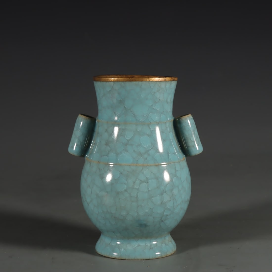 A Song Dynasty Ru kiln vase with sky-blue glaze and gold-inlaid buckle ear fittings: A sky-blue glazed gold-inlaid buckle ear vase from the Song Dynasty Ru kiln Size:H:14cm D:11cm (The Dimensions Of All Batches Are Manually Measured.If You Need More Detailed Information, Please Contac