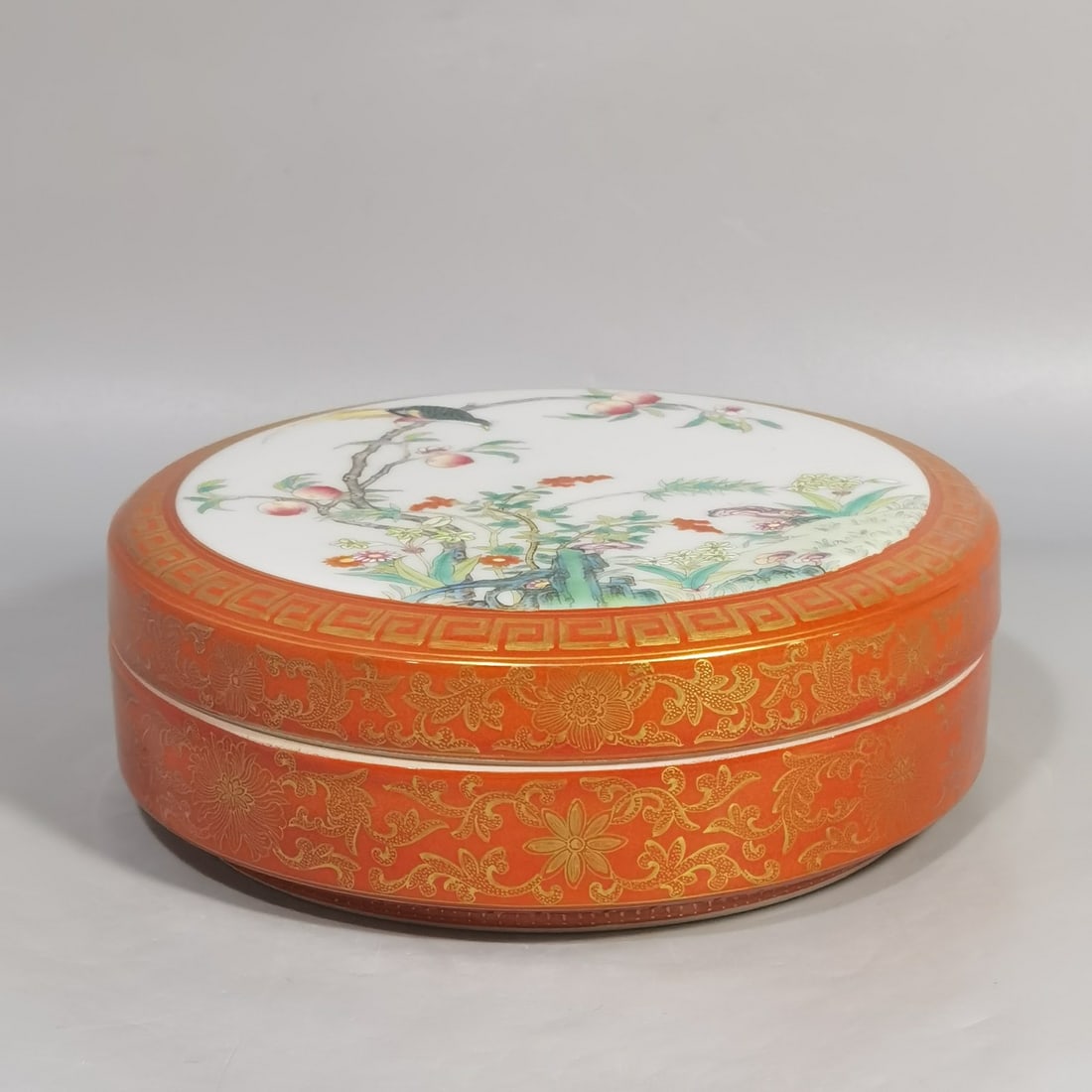 A delicate rouge box with alum red and gold famille rose floral and bird motifs (1 of 9)