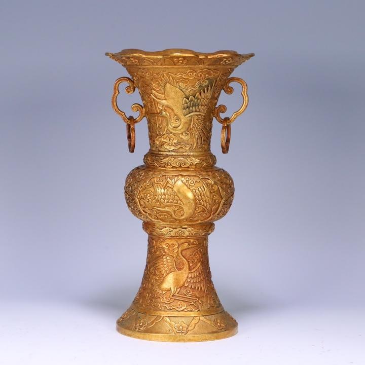 A finely crafted bronze gilt flower gu with auspicious clouds and white crane patterns: Exquisite bronze gilt flower goblet with auspicious clouds and white crane patterns Size:25.5x13.5 cm W: 1.3385 kg (The Dimensions Of All Batches Are Manually Measured.If You Need More Detailed Inform