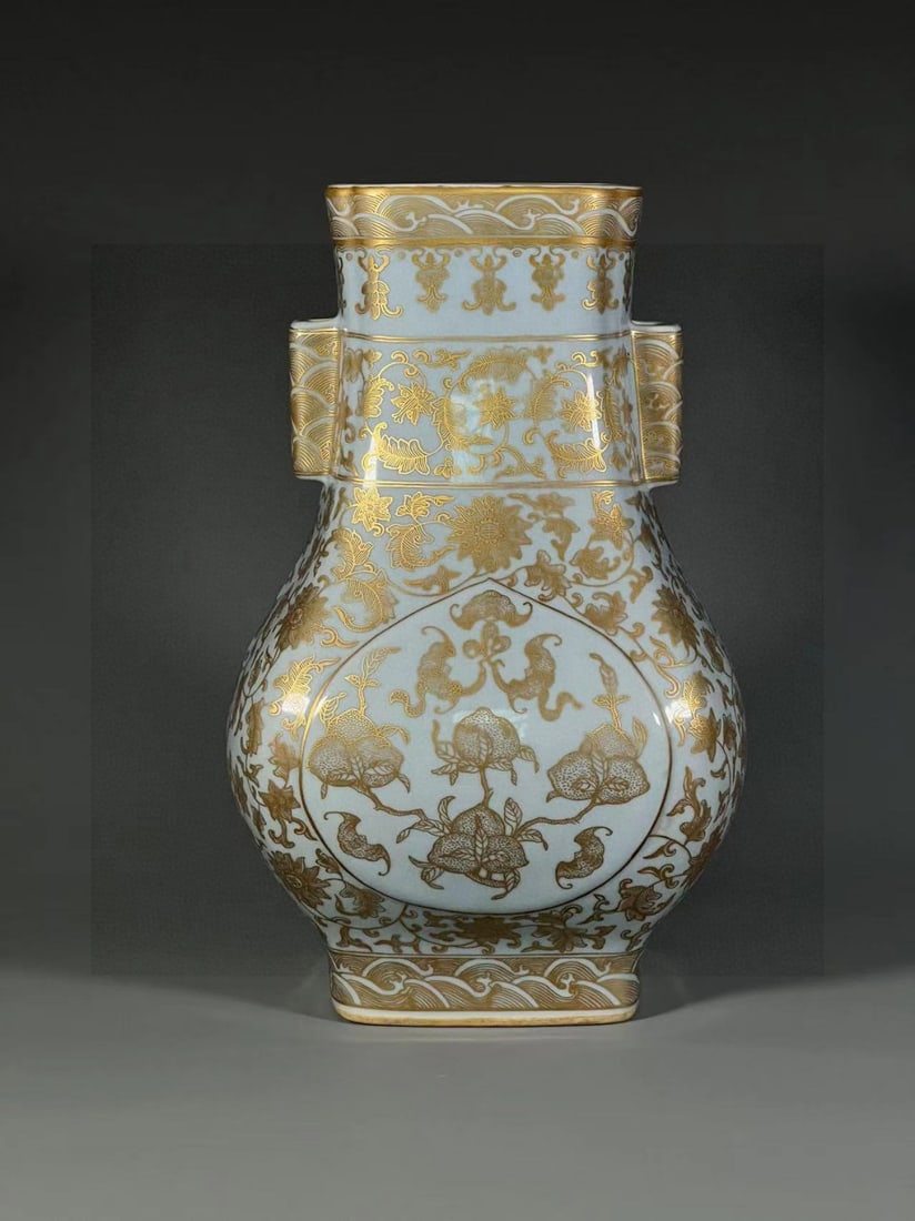 A Qing dynasty Qianlong period square vase with sky-blue glaze and gilded fortune and longevity: A sky-blue glazed gold-painted 'Fortune and Longevity Motif' square vase from the Qianlong period of the Qing Dynasty Size: H:31.6cmCalibre:11.9cmBottom12cm (The Dimensions Of All Batches Are Manually