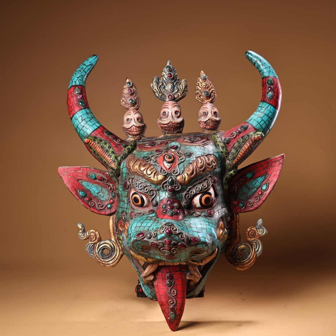 A finely crafted pure copper gem-inlaid gem-painted gilded guardian head of Maha Mahadara (1 of 9)