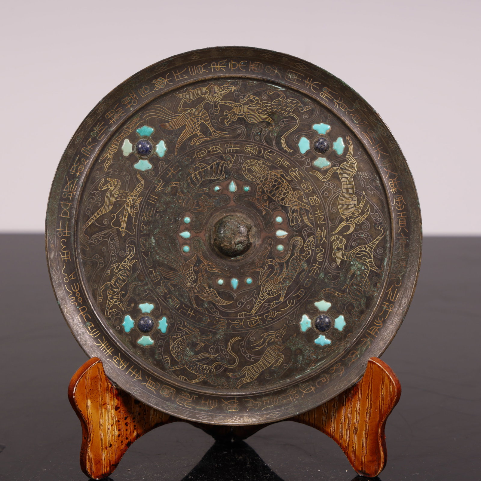 A Han Dynasty bronze mirror inlaid with gold and silver inlaid with turquoise (1 of 5)