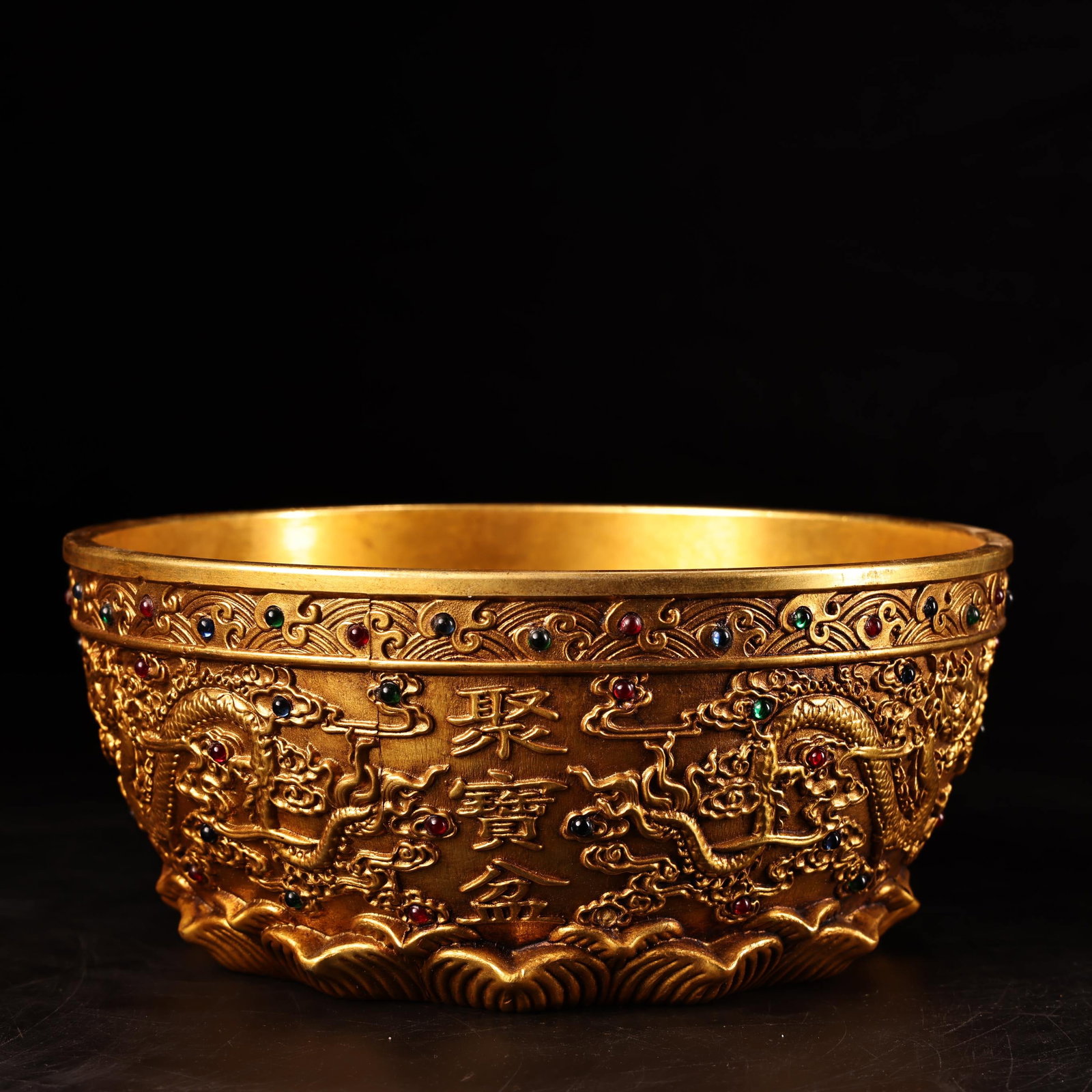 A finely crafted high-relief engraved gilt treasure bowl