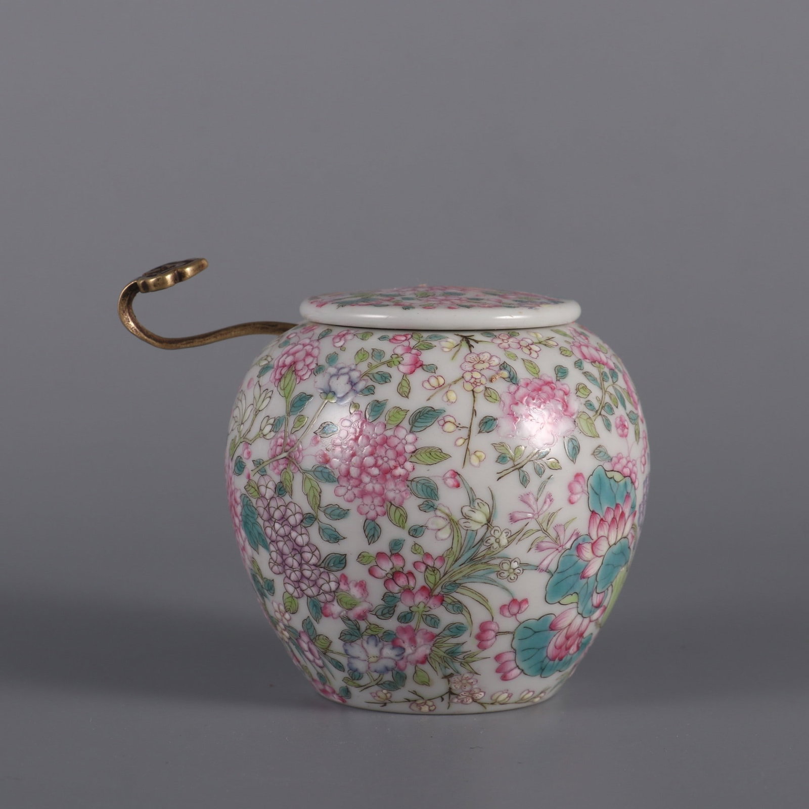 A famille rose water jar with hundred-flower patterns made during the Qianlong period of the Qing (1 of 9)