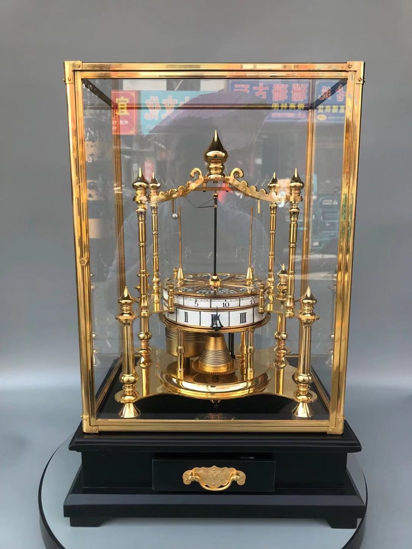 A fine porcelain dial pure copper gilt globe clock
