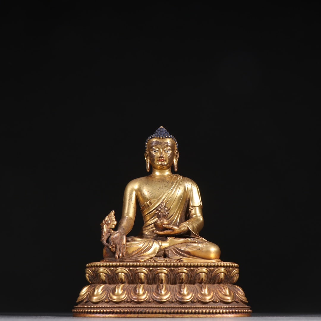 A Qing Dynasty gilt bronze seated Medicine Buddha statue (1 of 9)