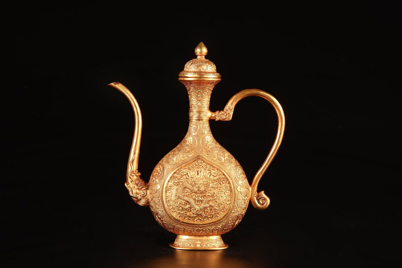 An Exquisite Gilt Bronze Auspicious Cloud and Dragon Pattern Beast-head Ewer: An Exquisite Gilt Bronze Auspicious Cloud and Dragon Pattern Beast-head Ewer,Qing Dynasty,China,Size:16cmx14cmx4cm,Weight:427g (The Dimensions Of All Batches Are Manually Measured.If You Need More Det