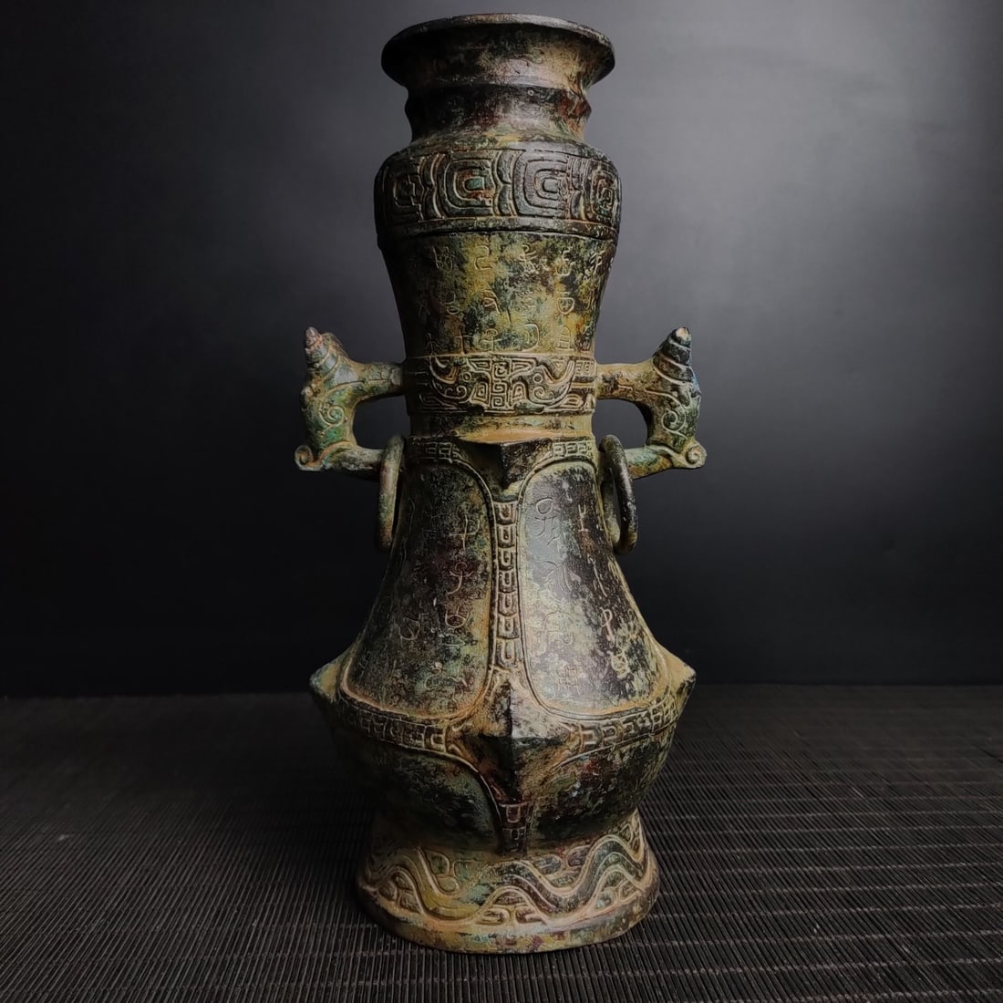 An Archaic Bronze Beast-Ears Vase,With Inscription: An Archaic Bronze Beast-Ears Vase,With Inscription,the Warring States period in China,Size:25cmx13cm,Weight:1600g (The Dimensions Of All Batches Are Manually Measured.If You Need More Detailed Informa