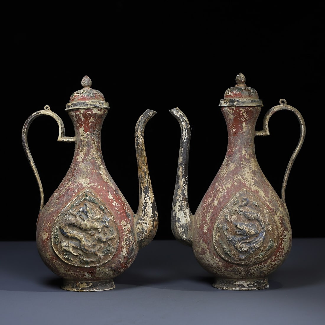 A pair of exquisite bronze painted engraved wine flasks