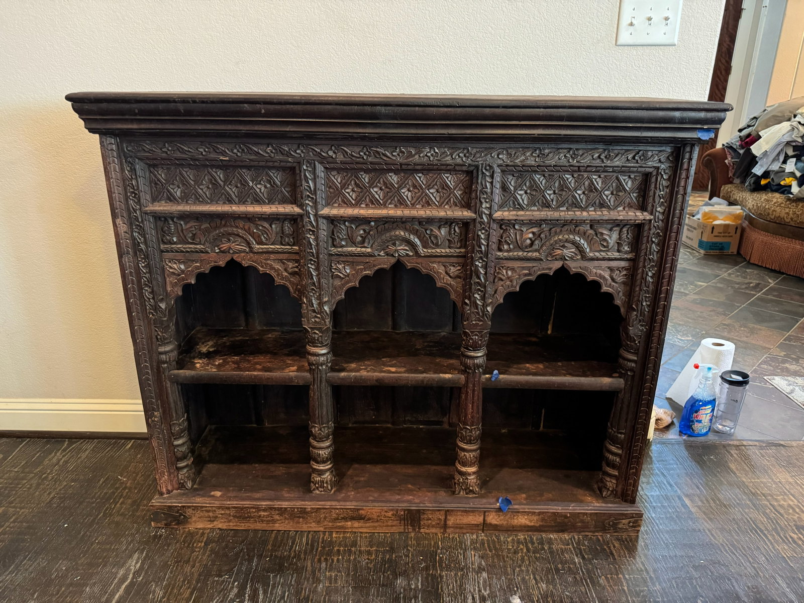 Ornate Jharokha Hand-Carved Cabinet: A monumental statement piece showcasing traditional craftsmanship! Styled after traditional Indian Jharokha bookcases, this exquisite open console bookcase features three deep bays framed by