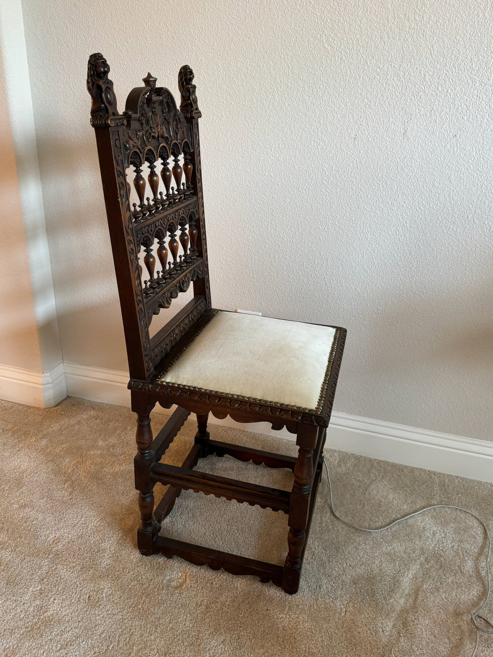 Spanish Revival Hand-Carved Walnut Side Chair: An extraordinary work of relief woodcarving! Designed in the traditional Spanish Revival style, this high-back side chair features a magnificent central splat hand-carved in high relief depicting the