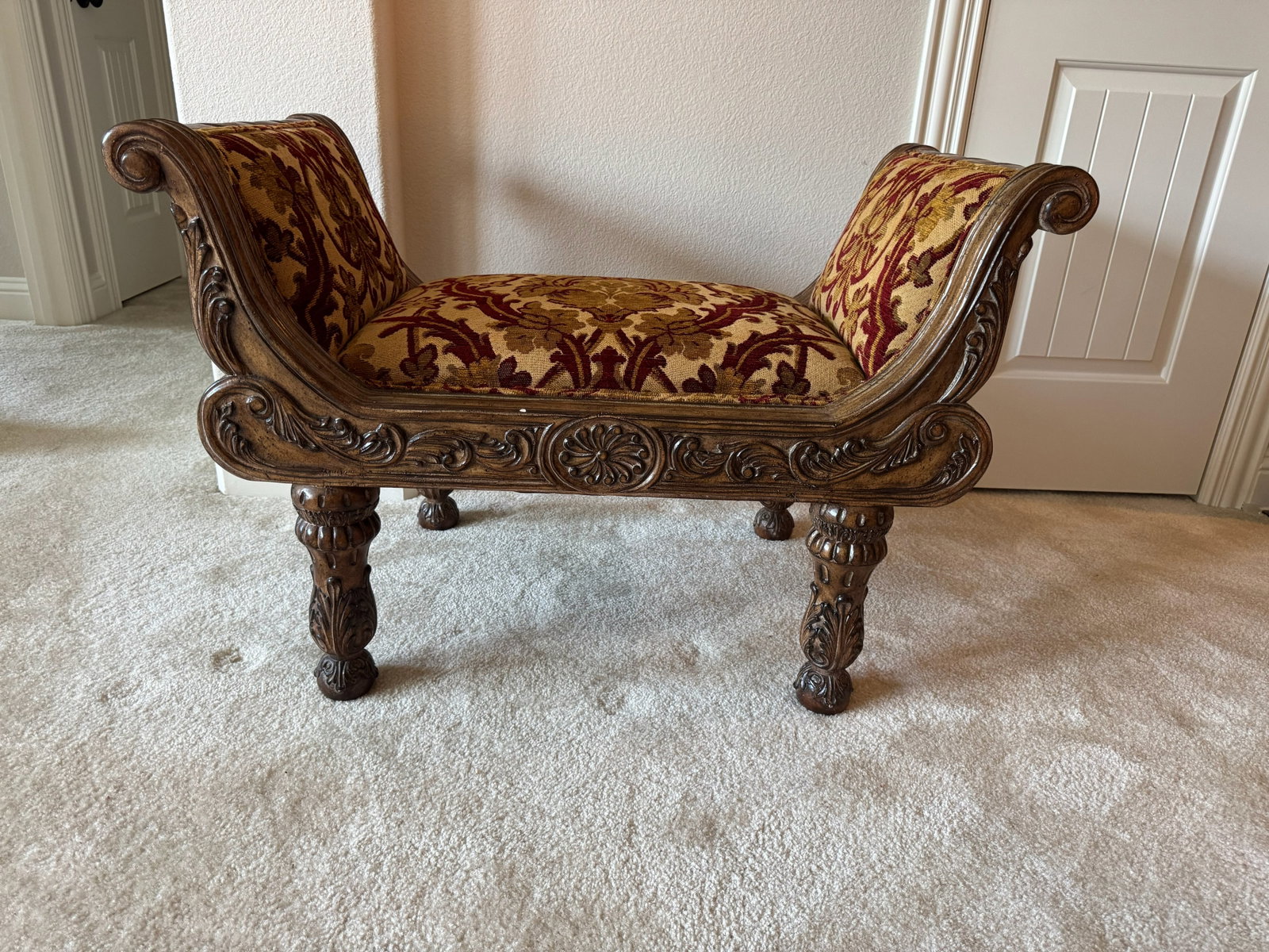 Traditional Carved Dark Wood Window Bench: Add elegant seating to a bedroom window, foyer, or dressing area with this classic curved window bench! Featuring a solid wood frame with deep fluted rope carvings, scrollwork side handles, and