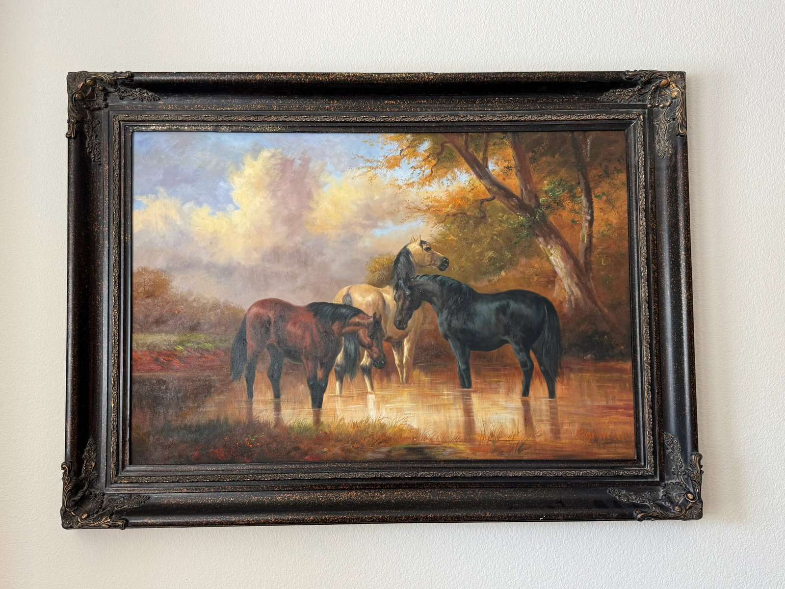 Fine Framed Oil Painting on Canvas: A stunning classical pastoral scene depicting three majestic horses wading in a tranquil woodland stream. Beautifully painted in rich oil tones, capturing light filtering through autumn leaves and