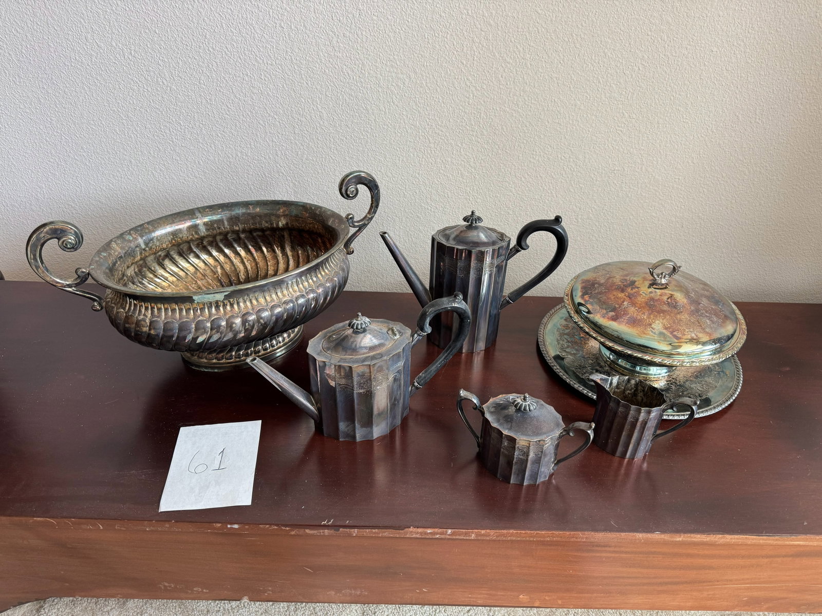 Vintage Silver-Plate Serving & Tea Service: Collection of six vintage silver-plated serving and tea service pieces in assorted forms and patterns. Pieces exhibit varying decorative details and finishes.