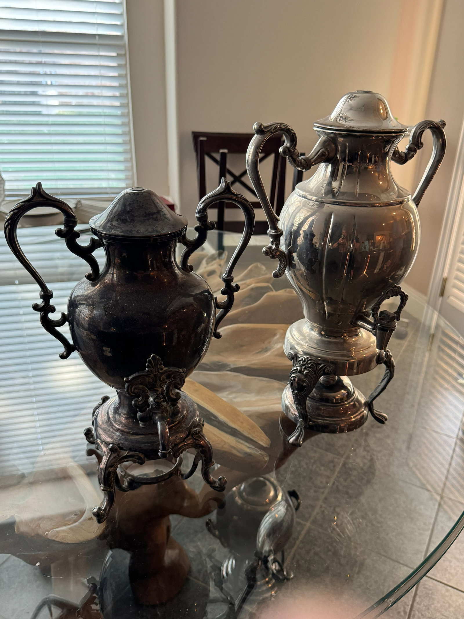 Pair of Vintage Rococo Style Silver-Plated Hot: Double the statement power! This impressive lot features two matching vintage silver-plated urn-form samovars/beverage servers. Each piece showcases a high-polish finish, ornate scroll handles, fluted