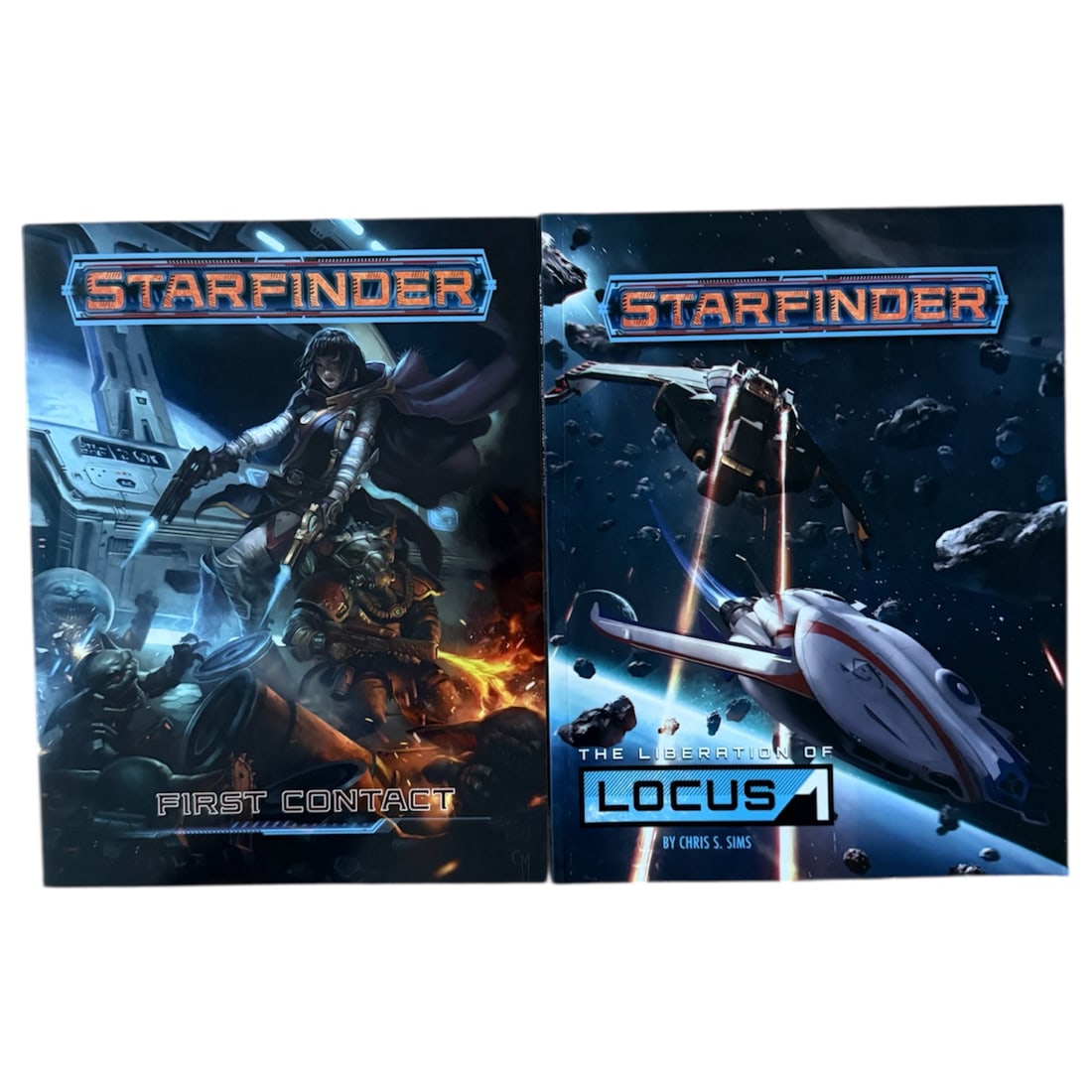 Stafinder Paperback Books: Two Paperback Starfinder Books:The Liberation of Locus 1First ContactEach book measures:Height 11 x Width 8.5 x Depth 0.125 in inches.Combined for shipping:Height 11 x Width 8.5 x Depth 0.25 in