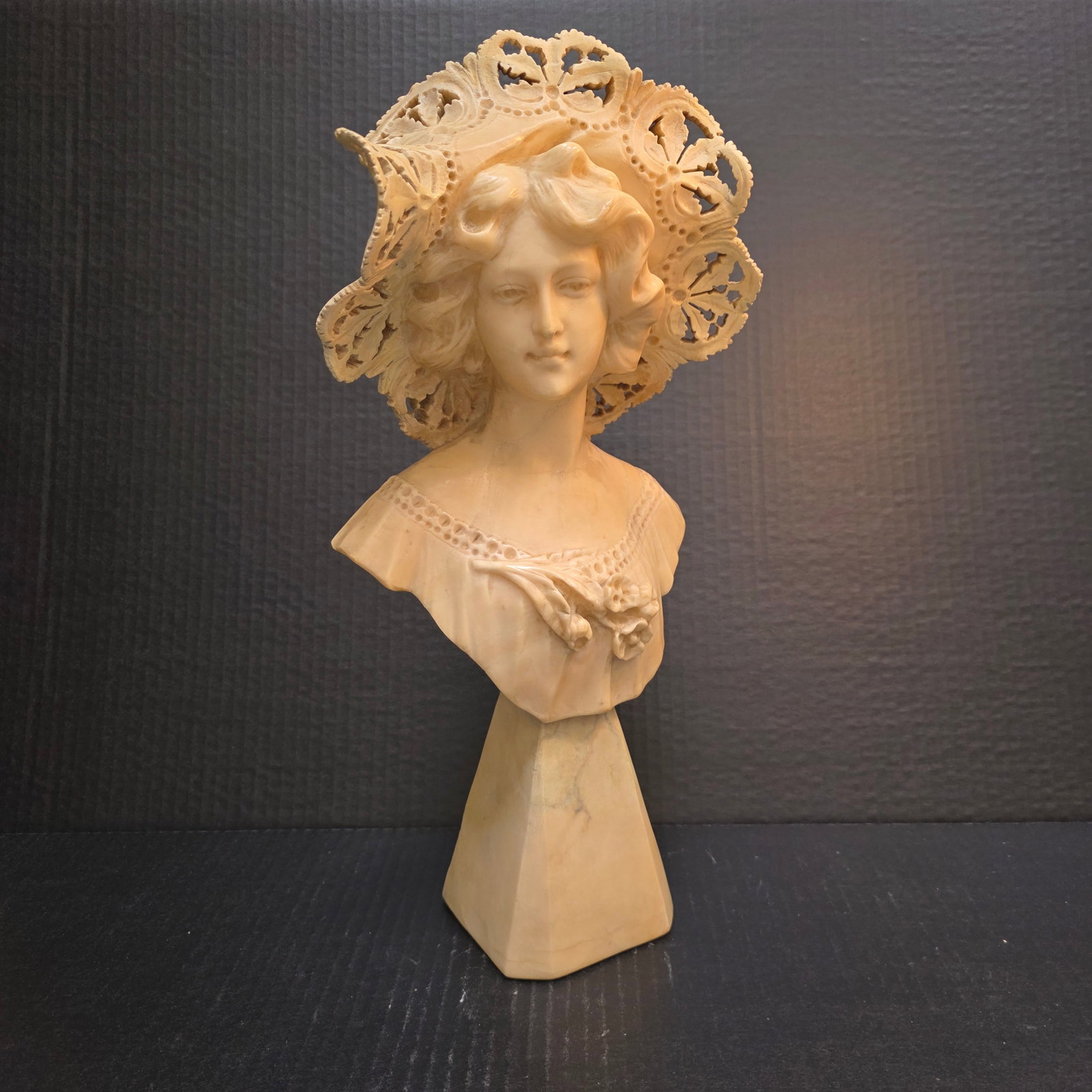 Alabaster Bust of Girl in Bonnet: 19th Century hand-carved bust with lacy detailing on the bonnet and dress.Unsigned piece