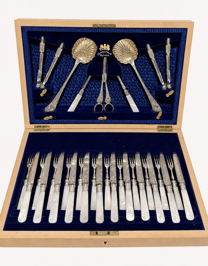 Victorian Fruit and Nut Service With Mother of Pearl Handles in Case: See this beautiful set consisting of 12 matching pairs of forks and knives with silver-plated blades and tines with mother-of-pearl handles.Two ornate metal nutcrackers for cracking hard-shelled