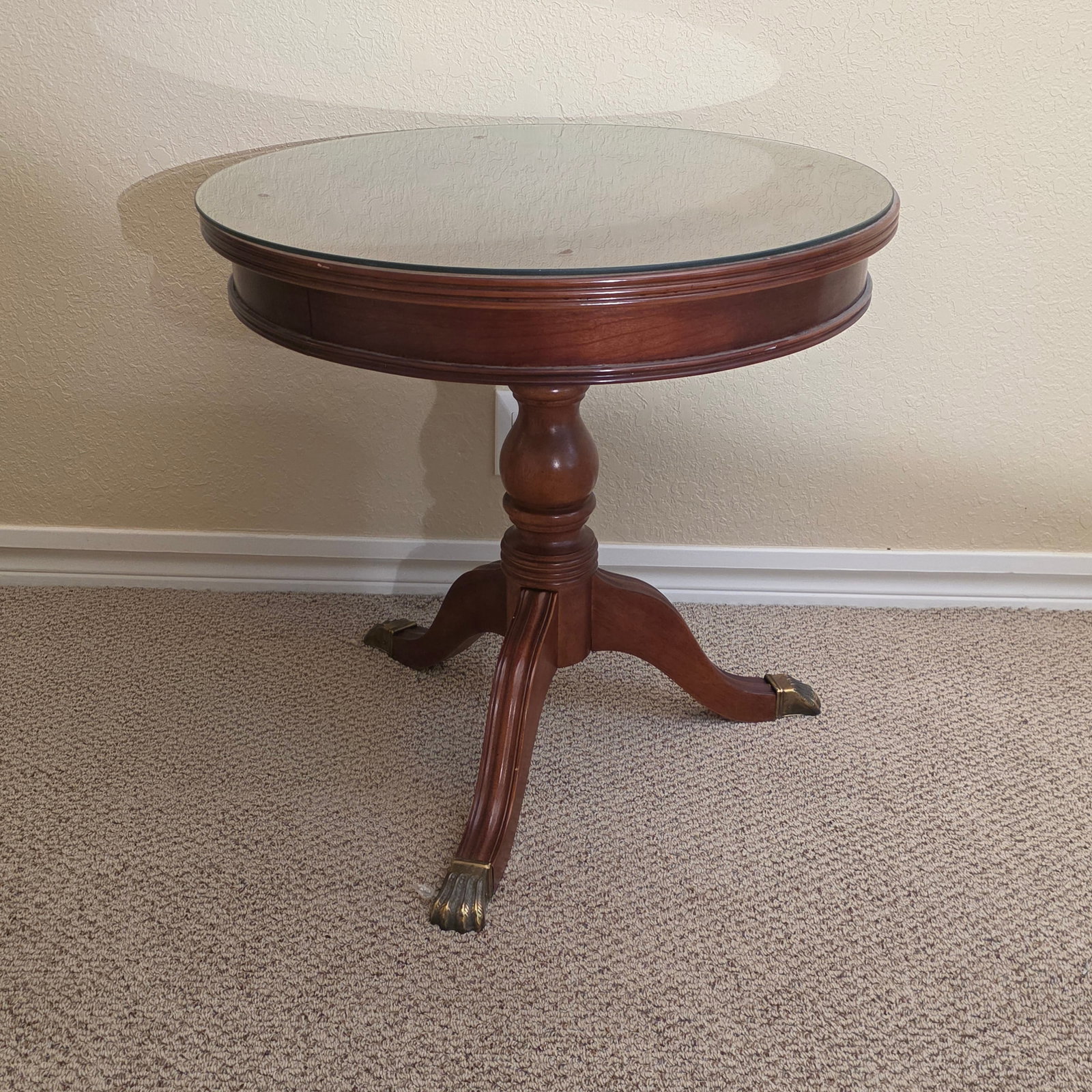 Vintage Regency-style Mahogany Drum Pedestal Table: An elegant and timeless vintage Duncan Phyfe / Regency-style round drum table crafted from rich, warm mahogany. This classic accent piece features a beautiful book-matched wood grain tabletop,