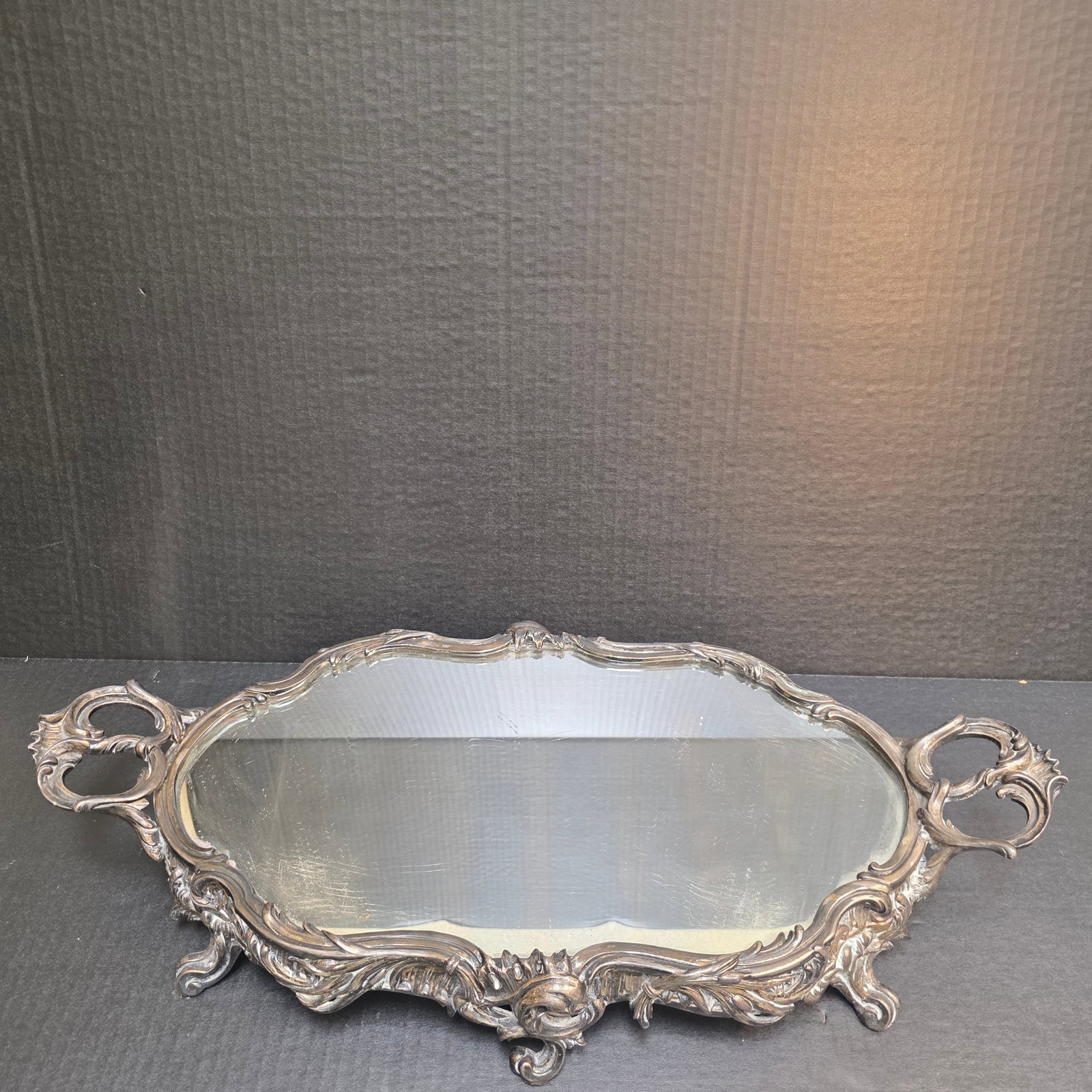Louis XV Style Mirrored Tray: Beautiful organic lines and ornate handles make this mirrored tray an elegant addition to any decor