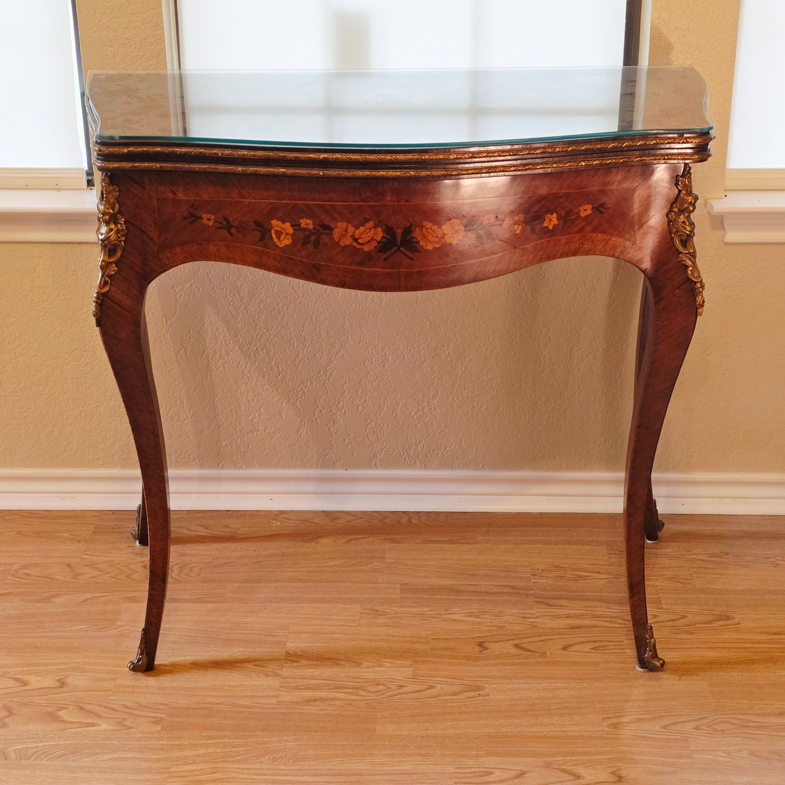 Louis XV Style Flip Top Convertible Card Table with Marquetry: Purchased in Argentina and brought to the United States, this wonderful, convertible card table is made by Taller Artístico de Muebles and stamped Joaquín González. The game table side is covered