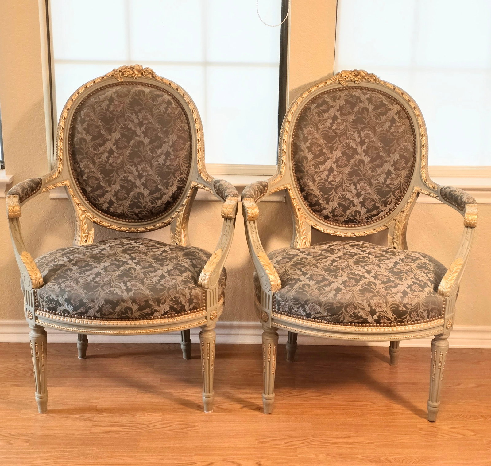 Pair of Green/Gray Louis XVI-style Medallion Chairs with Arms: This gorgeous pair of chairs feel absolutely regal. The Damask upholstery is a beautiful. The gold gilt is in fantastic shape and really pops on the Green/Gray frames