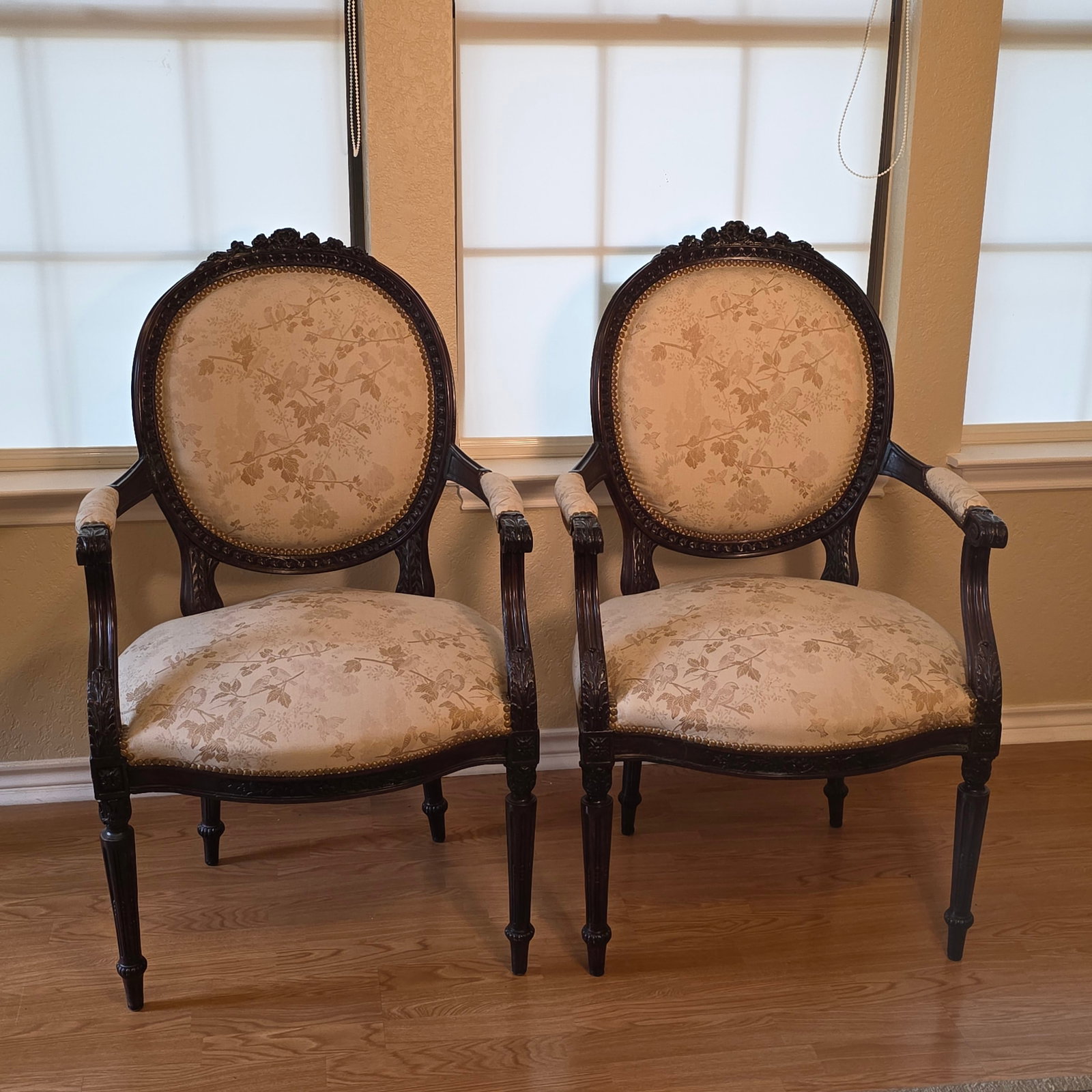 Pair of Vintage Louis XVI Style Chairs in Cream Damask Upholstery: Gorgeous carved wood frames enhance the bird motif upholstery. The seats have ample room and are quite comfortable