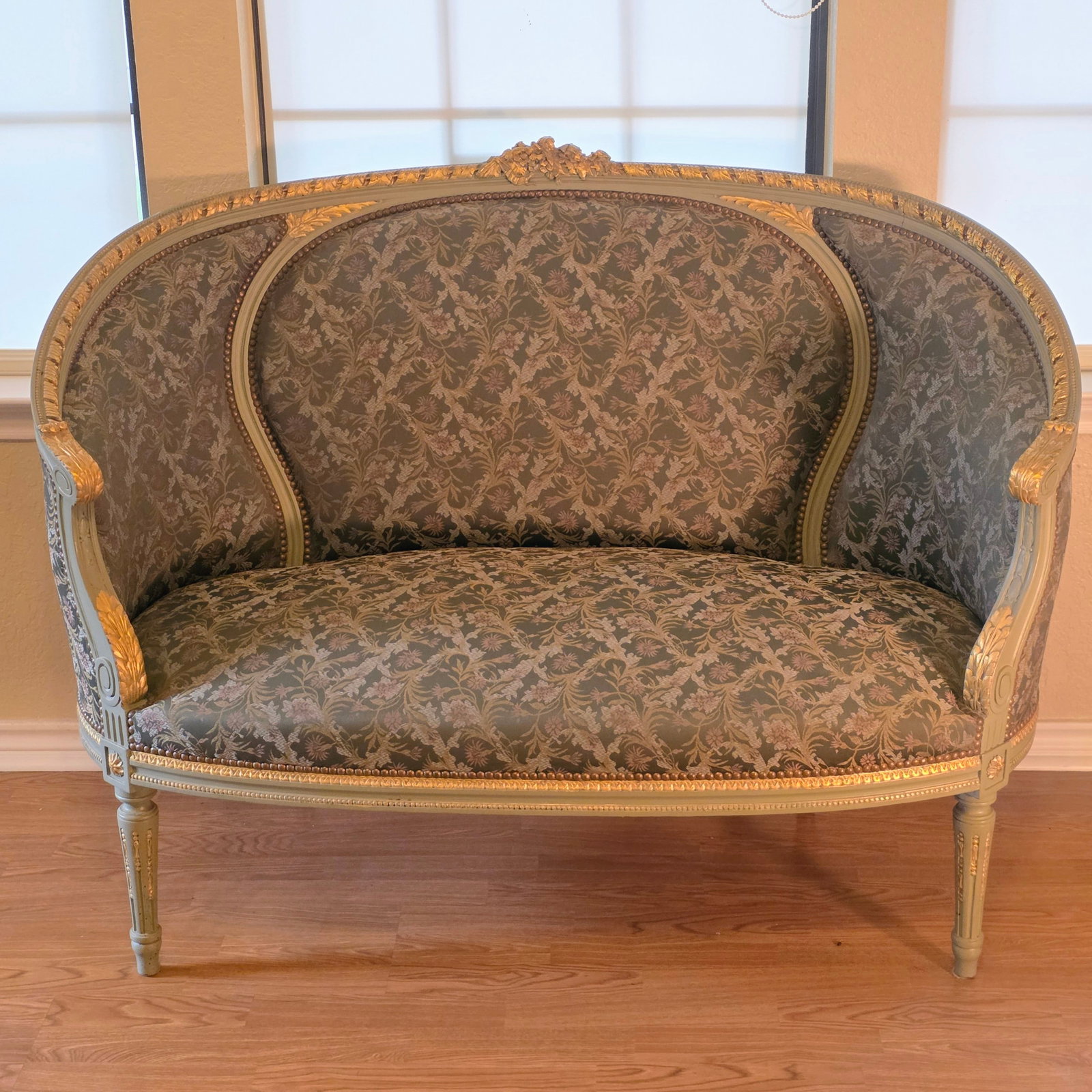 Louis XVI Style Green/Gray Giltwood Settee with Damask Upholstery: A corbeille setee in a beautiful green/gray color with gilt and ribbon crest. The small sofa features a gorgeous damask upholstery front and back.