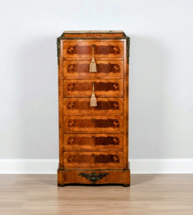 7 Drawer Wellington Lingerie Chest with Marble Top: A handsome and finely crafted tall boy (semainier) featuring a profusion of intricate floral marquetry inlay throughout the drawer fronts. The piece is topped with marble and embellished with