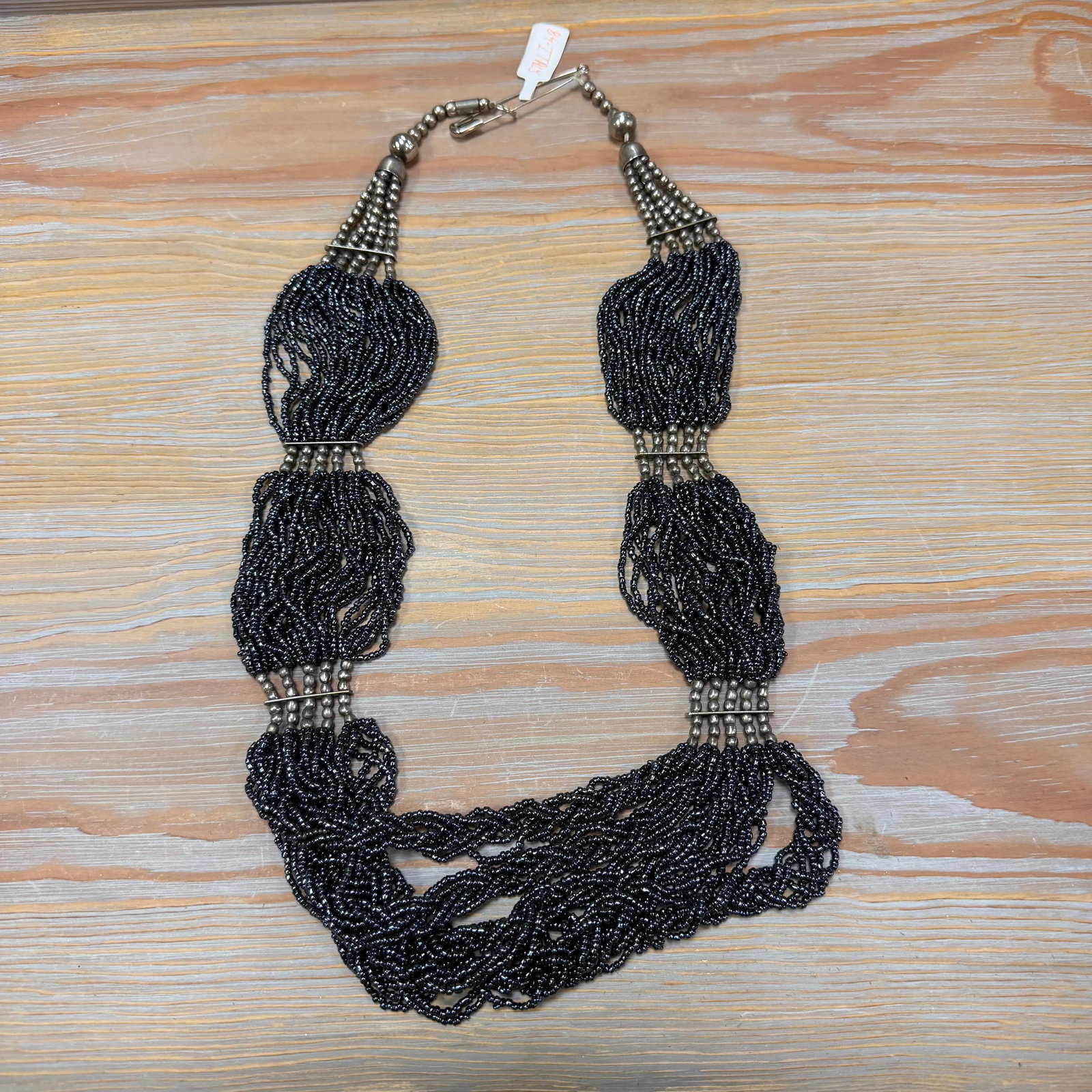 Multi-Strand Seed Bead Necklace 20" Length, HD41: Dozens of charcoal-black seed bead strands with silver spacers.